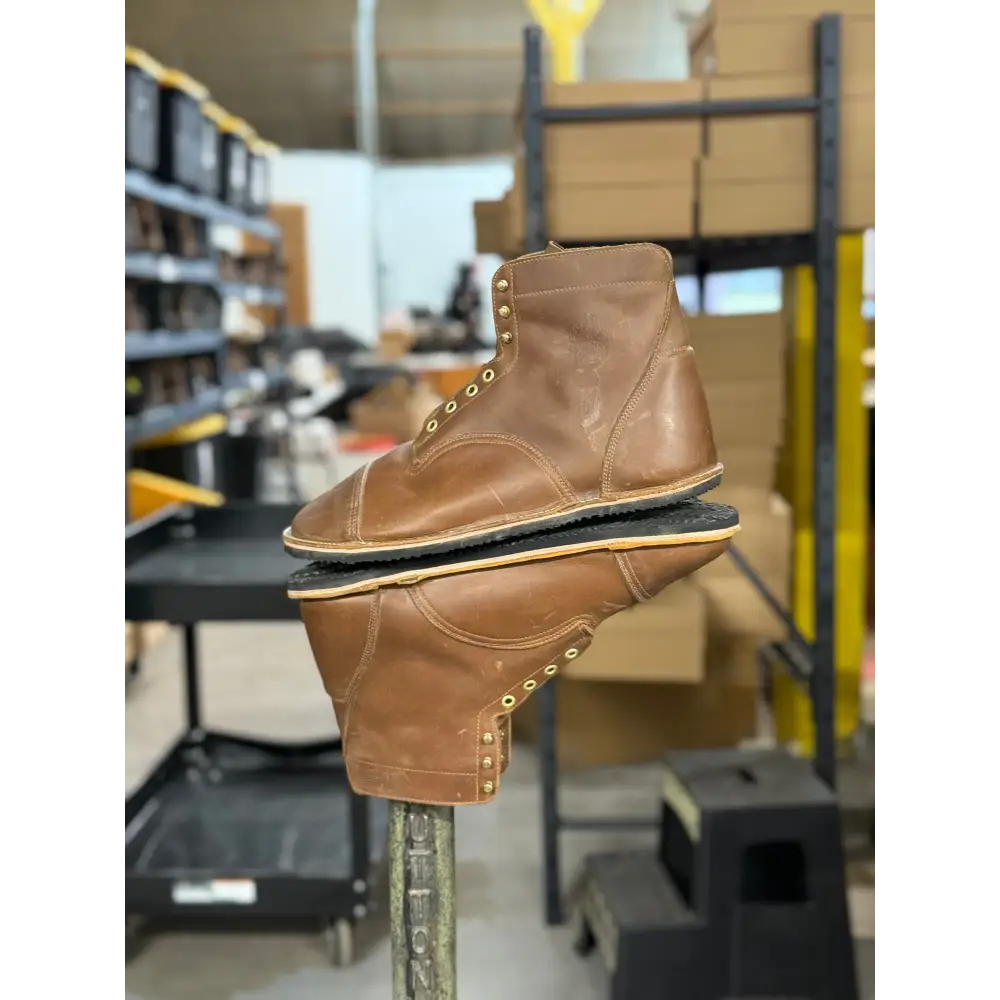 Brown leather work boot with brass eyelets, black sole from Barely Used Footwear