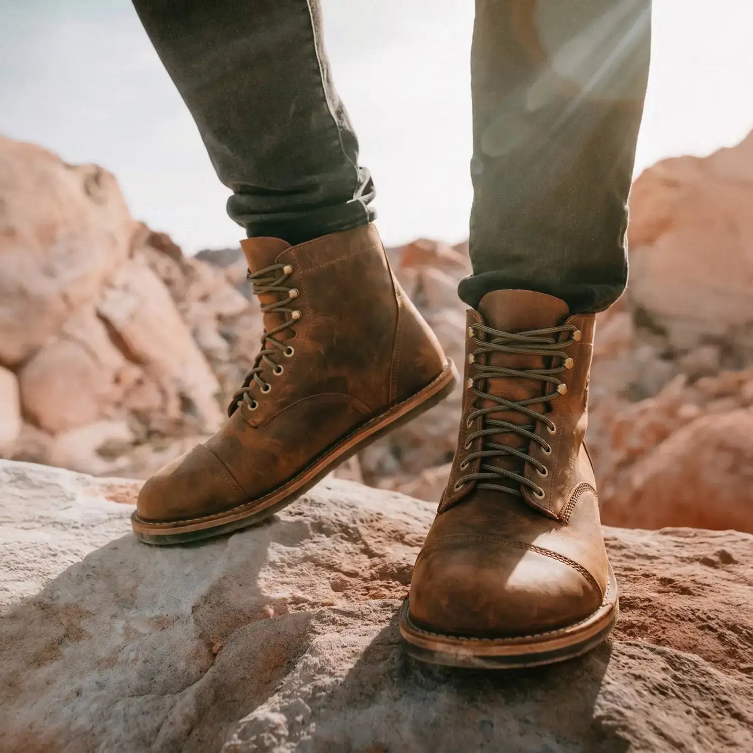 Brown leather lace-up work boots with a rugged, worn-in appearance and sturdy soles.