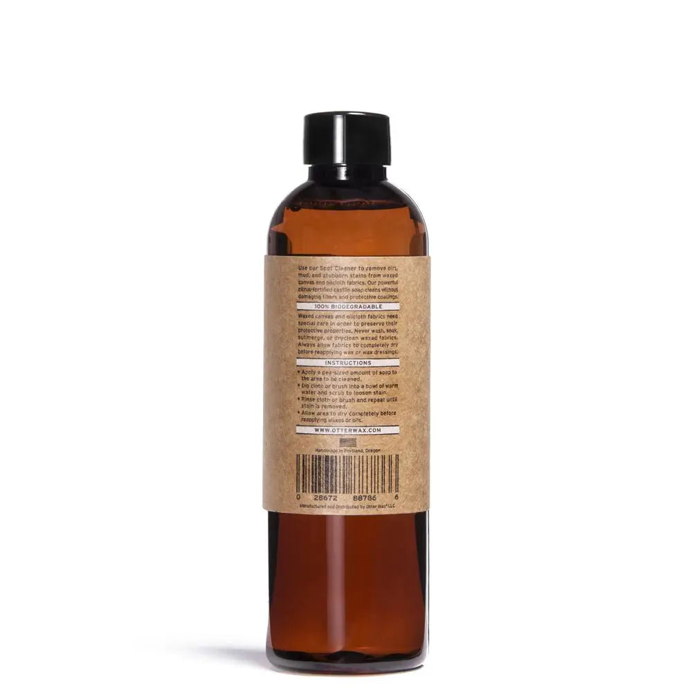 Canvas Spot Cleaner in amber bottle with black cap and waxed canvas label